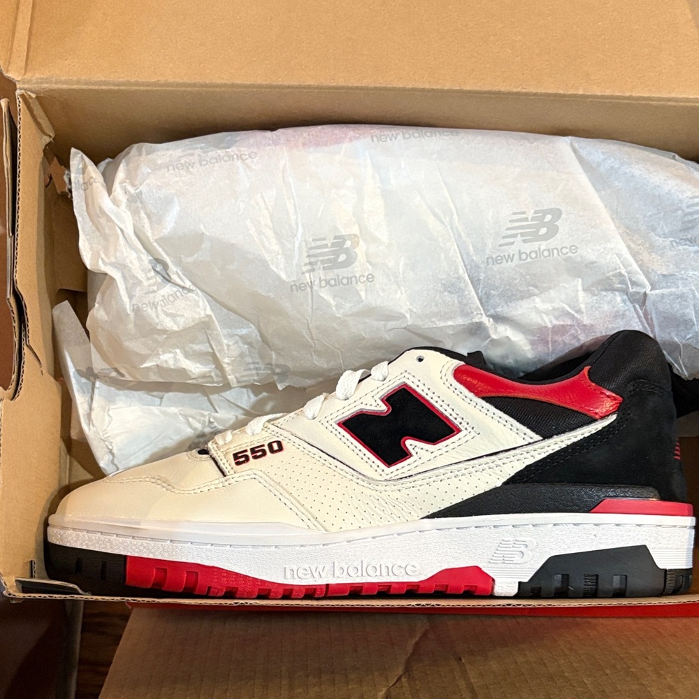 New Balance 550 White and Black Sneakers with Red Accents